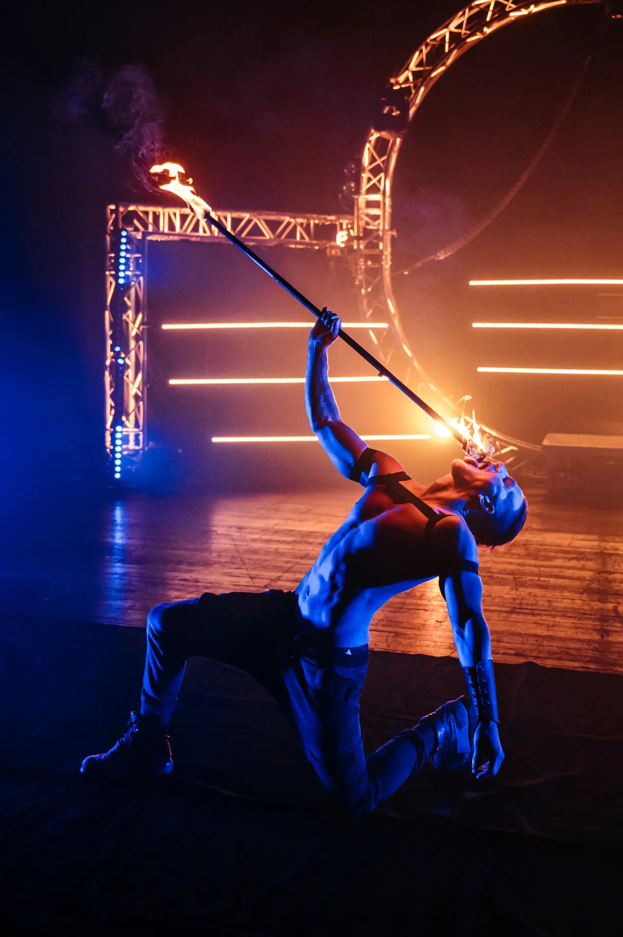 Fire performer creating a flame display at an evening event (photo 3)