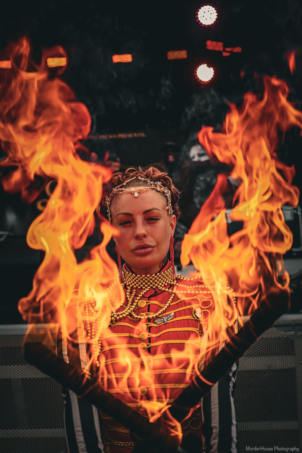 Fire performer creating a flame display at an evening event (photo 2)