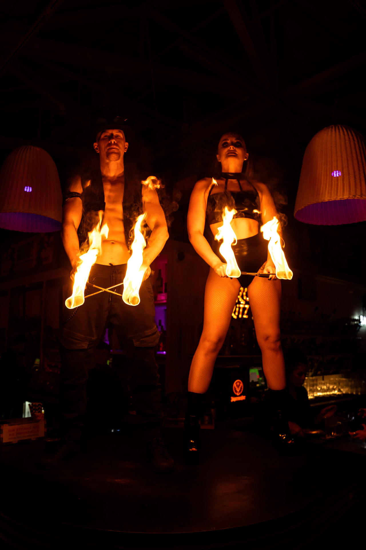 Fire performer creating a flame display at an evening event (photo 4)