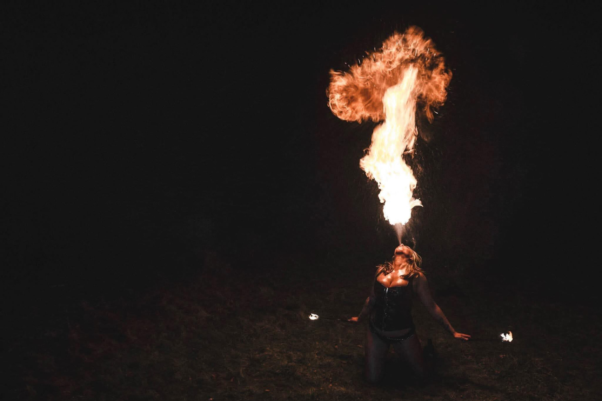 Fire performer creating a flame display at an evening event (photo 5)